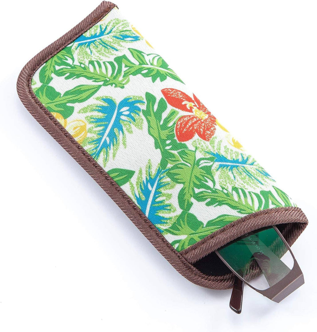 Slim tropical leaf eyeglasses pouch with brown trim; glasses peeking from folded top