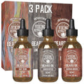 Beard oil 3-pack bottles with amber liquid and black droppers, assorted scents