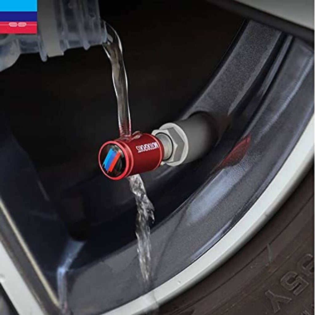 Red valve stem cap on wheel rim with water spray testing fit