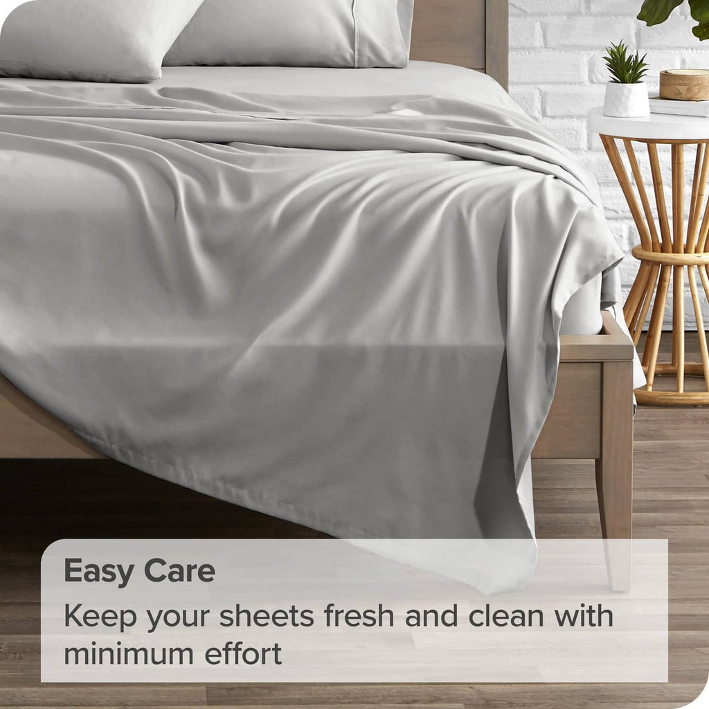 Light grey queen flat sheet with natural crease lines and layered drape