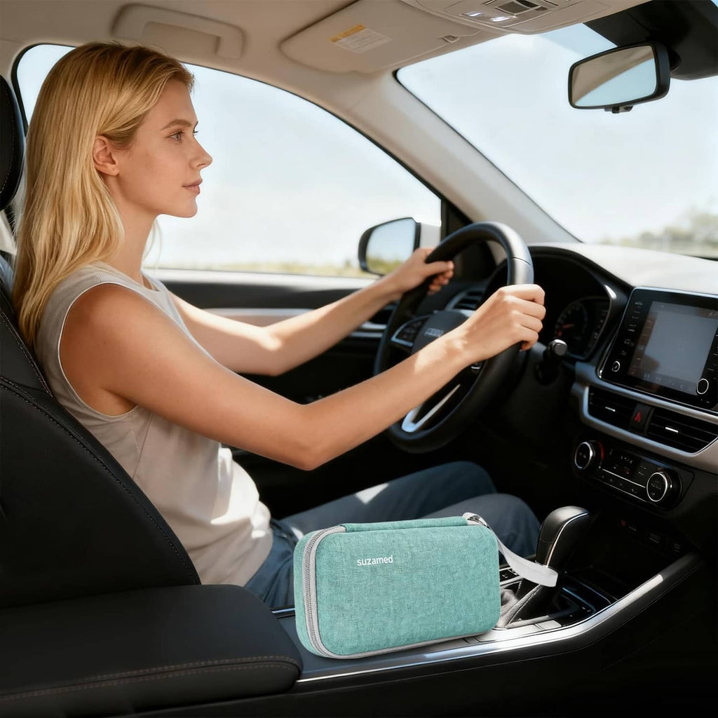 Teal insulin cooler travel case with wrist strap, on the car seat
