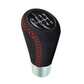 Leather 6-speed shift knob in black with red cross-stitch and silver base, shift dial