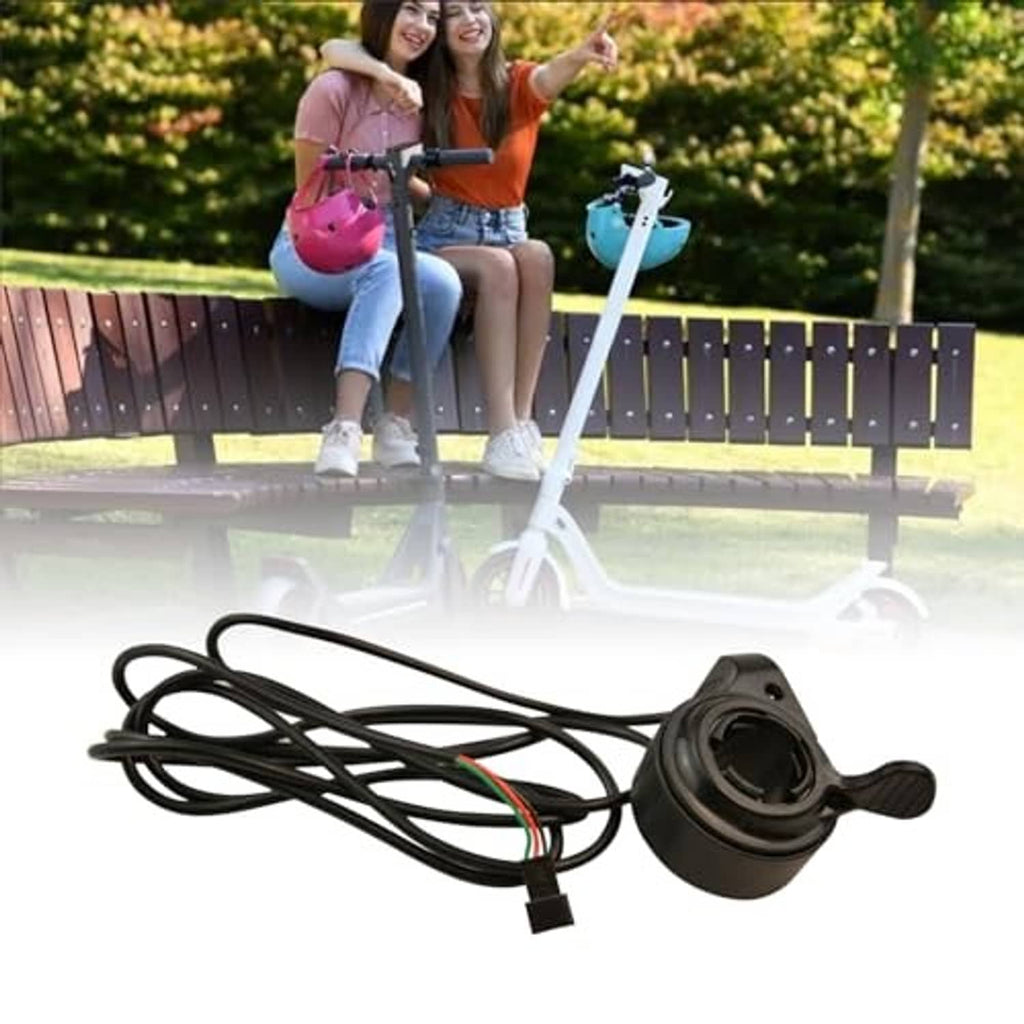 Black thumb throttle set with wiring harness, mounted on electric scooter handlebar