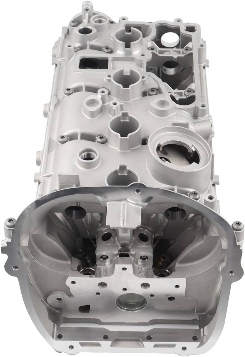 Cylinder head assembly showing interior chambers, camshaft area, and circular openings