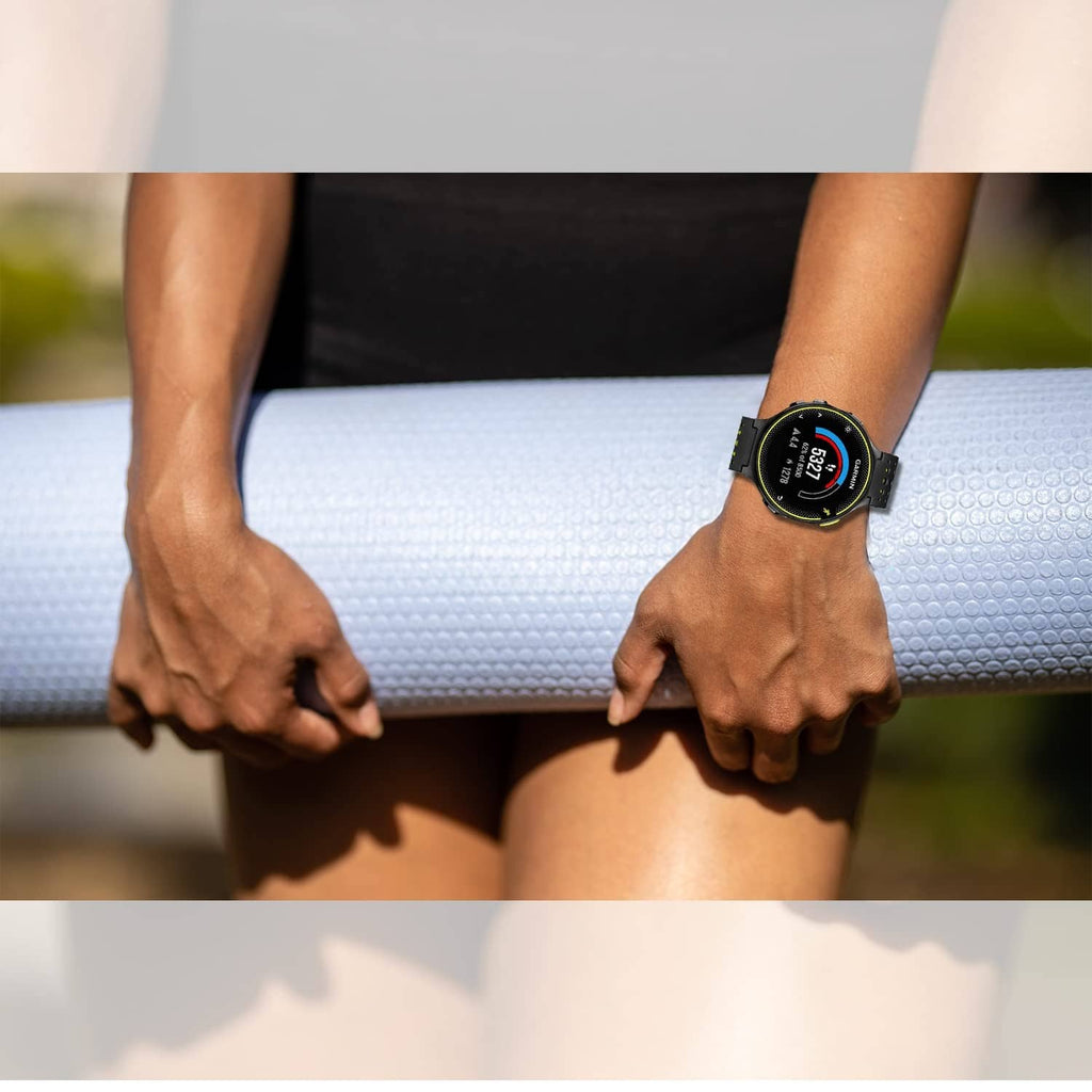 Black perforated smartwatch band worn on runner's wrist outdoors