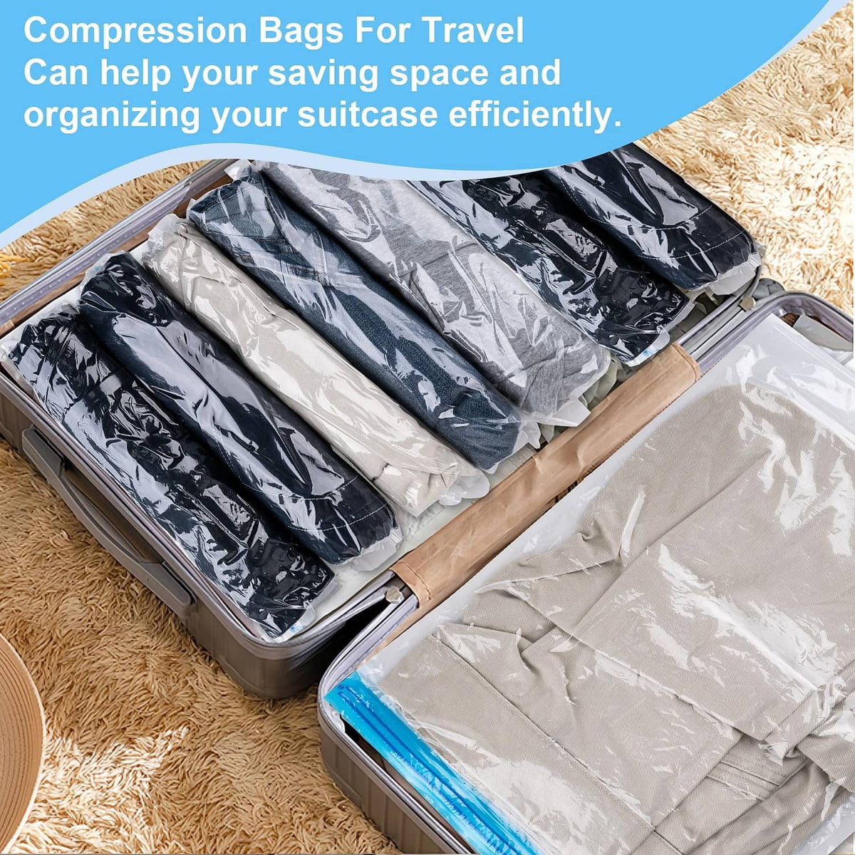 Gray compression bags in open suitcase, holding neatly folded clothing layers