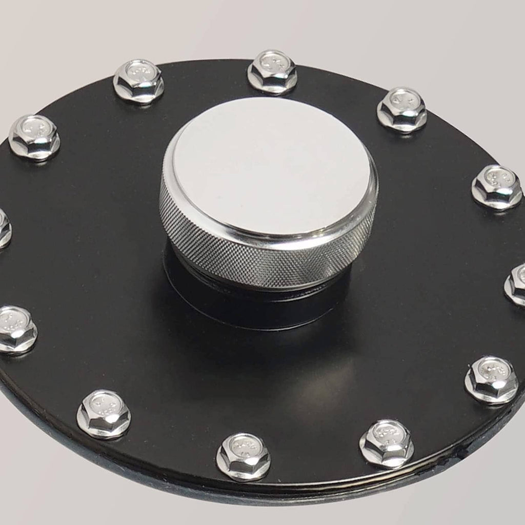 Round fuel cap on black mounting plate with hex bolts