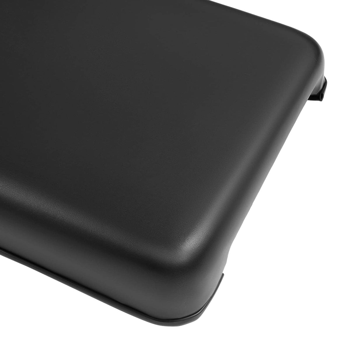 Black vinyl seat cushion corner with rounded edge and smooth contoured surface