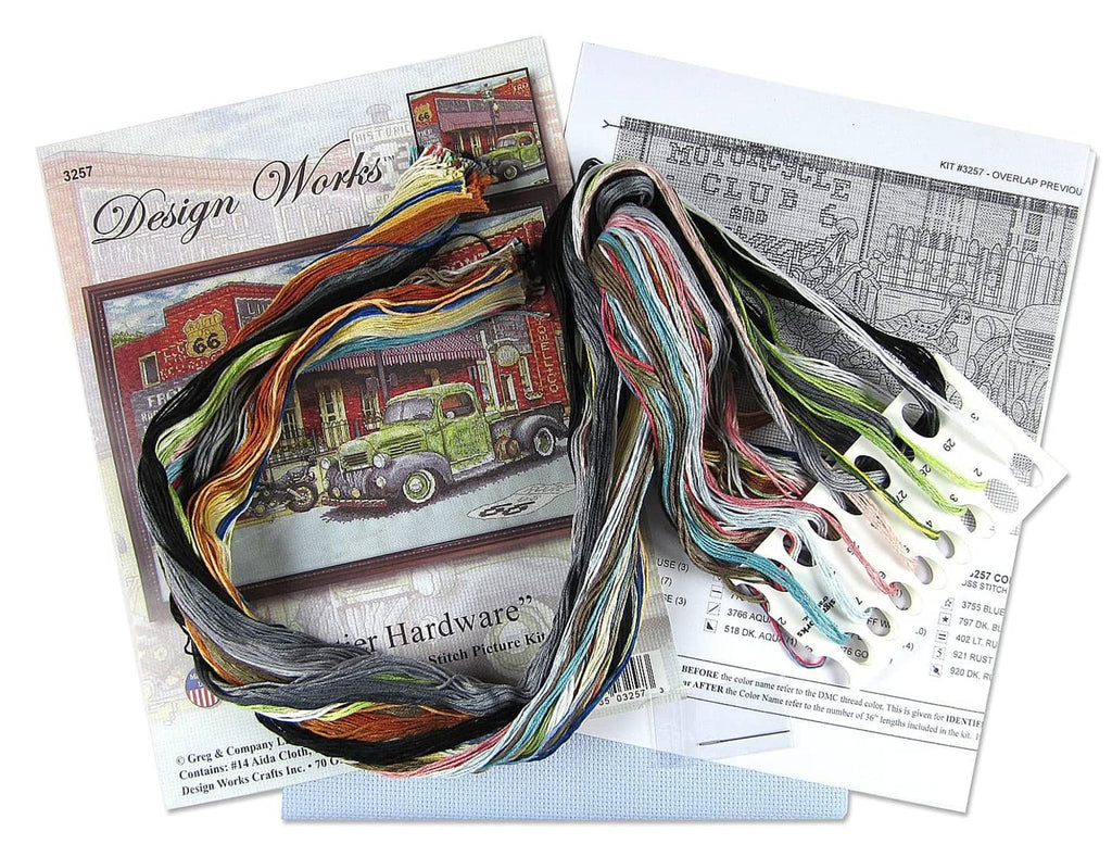 Cross stitch kit contents: printed pattern pages and multicolor embroidery floss bundles