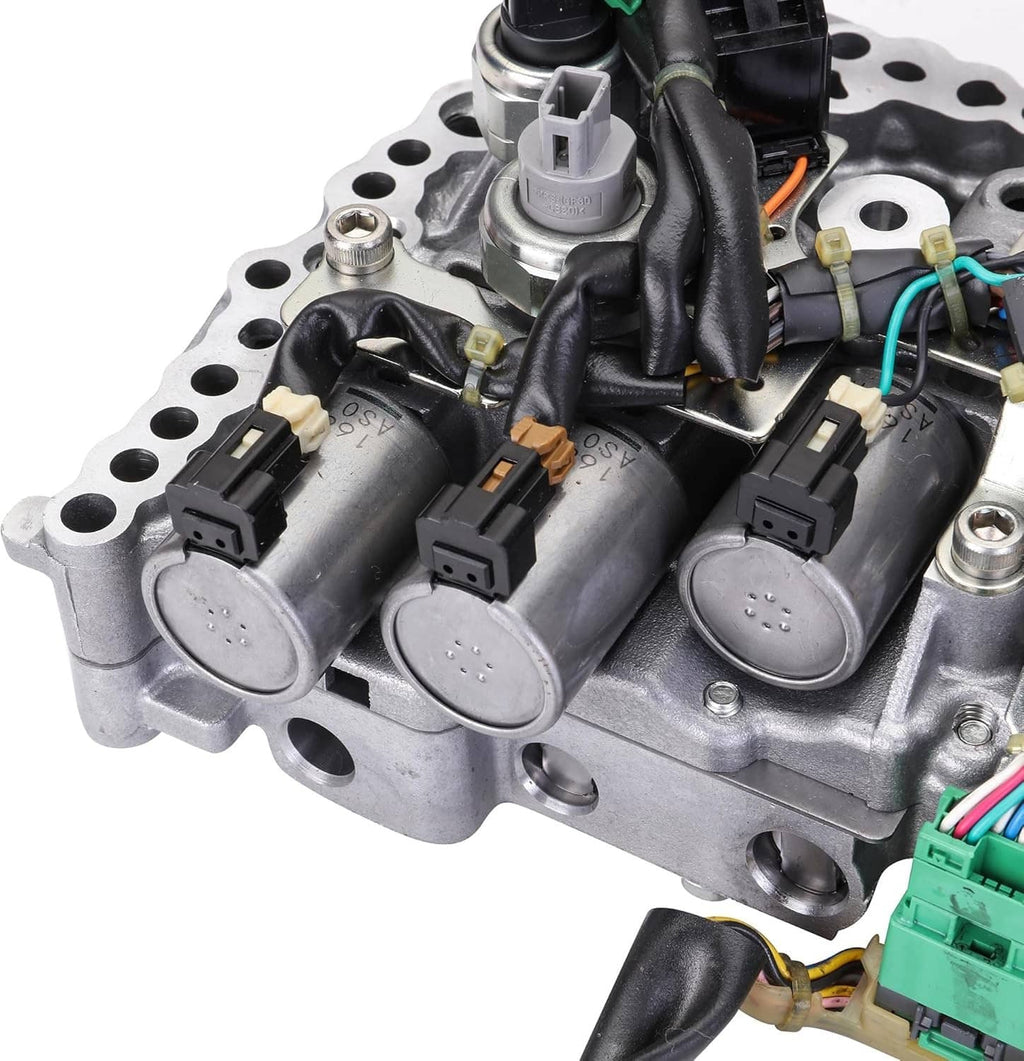 CVT transmission valve body close-up with solenoids, wiring connectors, and metal housing