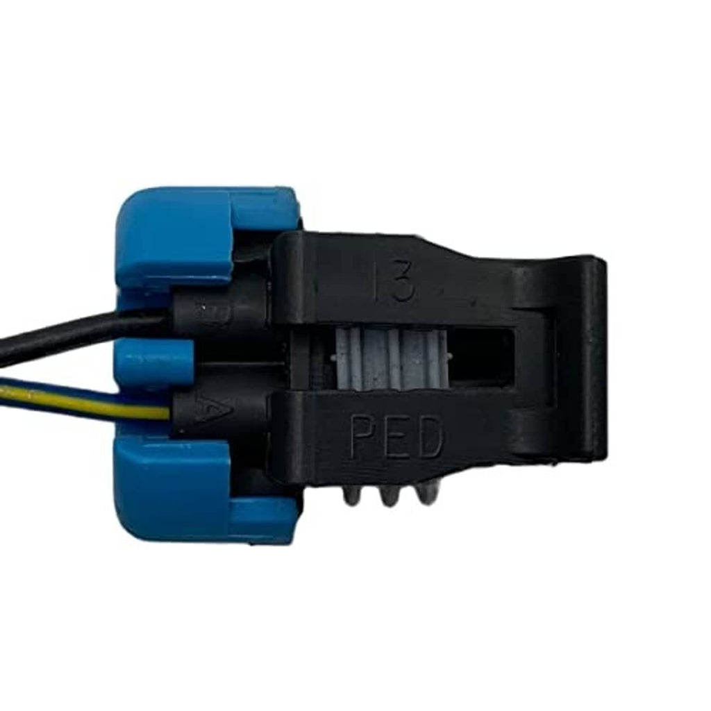 Wheel speed sensor wiring connector showing black housing, blue plugs, and terminal contacts