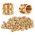 Brass knurled threaded heat-set insert nuts with flanged heads, close-up angles