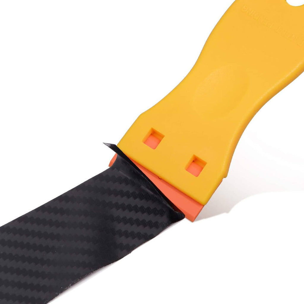Close-up of yellow plastic scraper with exposed double-edge blade, orange base and blade