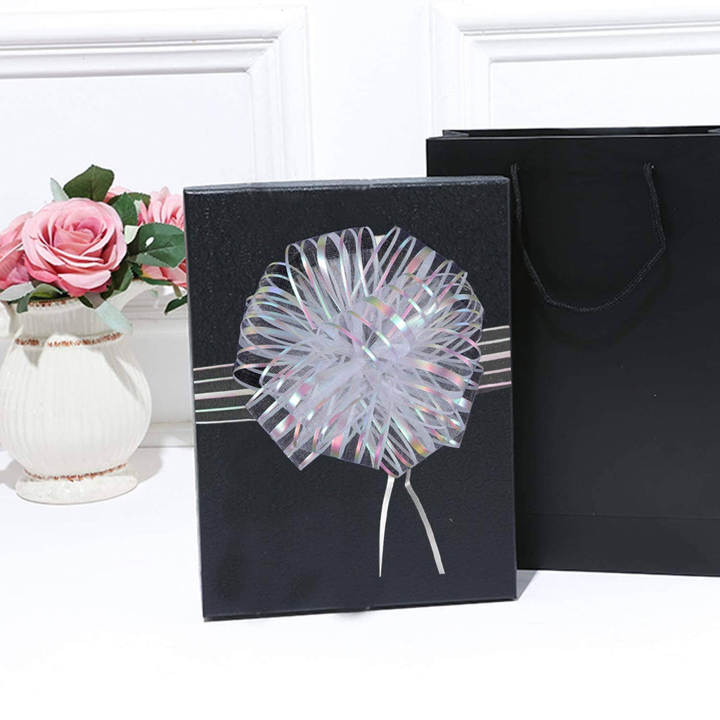 White organza pull bow with metallic shine and long striped ribbon streamers
