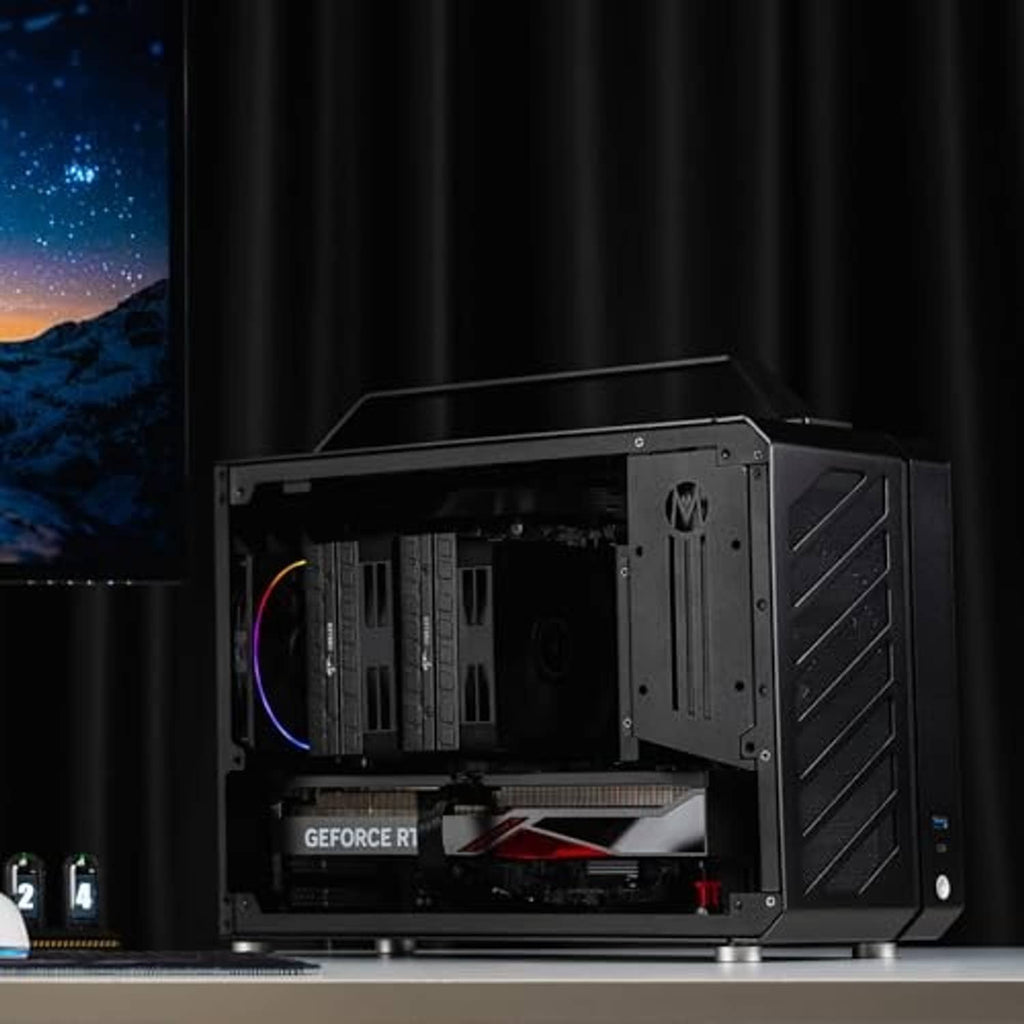 Black compact PC case with open side and visible interior hardware