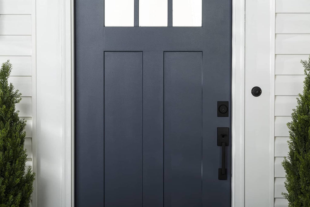 Dark navy front door with satin finish, centered close-up