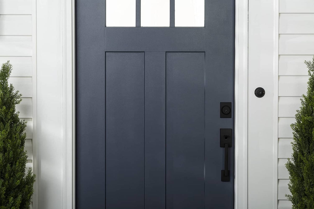 Dark navy front door with satin finish, centered close-up