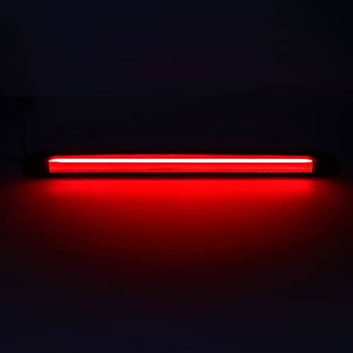 Red LED third brake light strip glowing, slim rectangular design