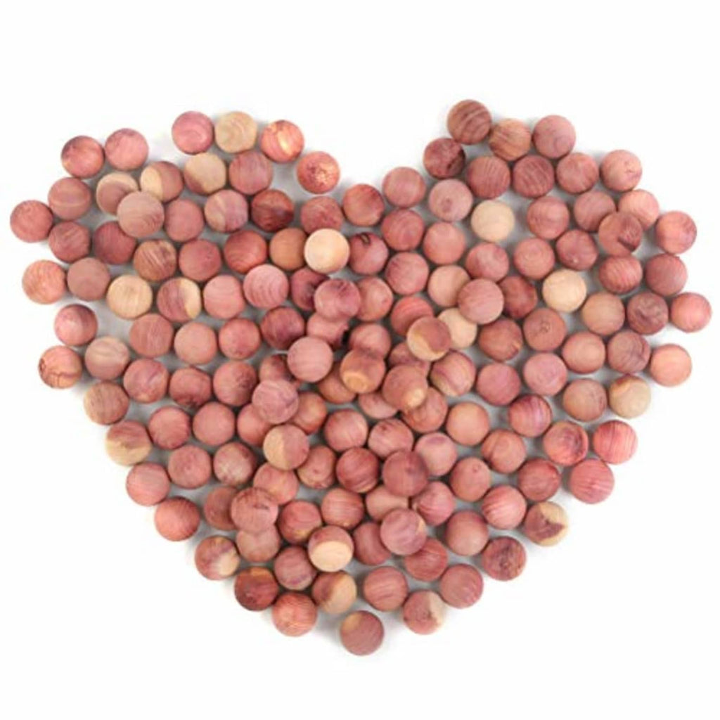 150 natural cedar blocks, round wooden discs scattered in pink, tan, and brown tones.