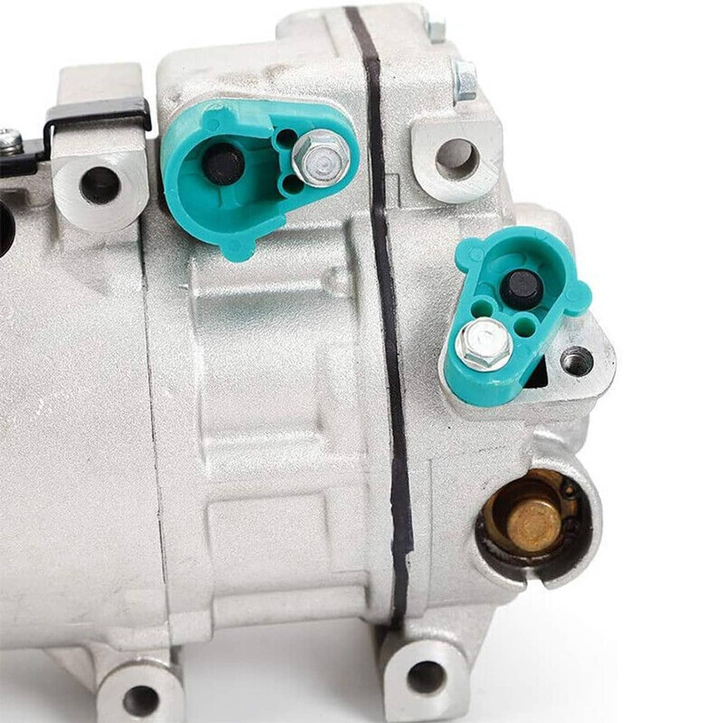A/C compressor with clutch, close-up of teal electrical connectors on silver housing