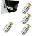 Set of silver car tire valve stem caps with colorful indicator bands, 4-pack