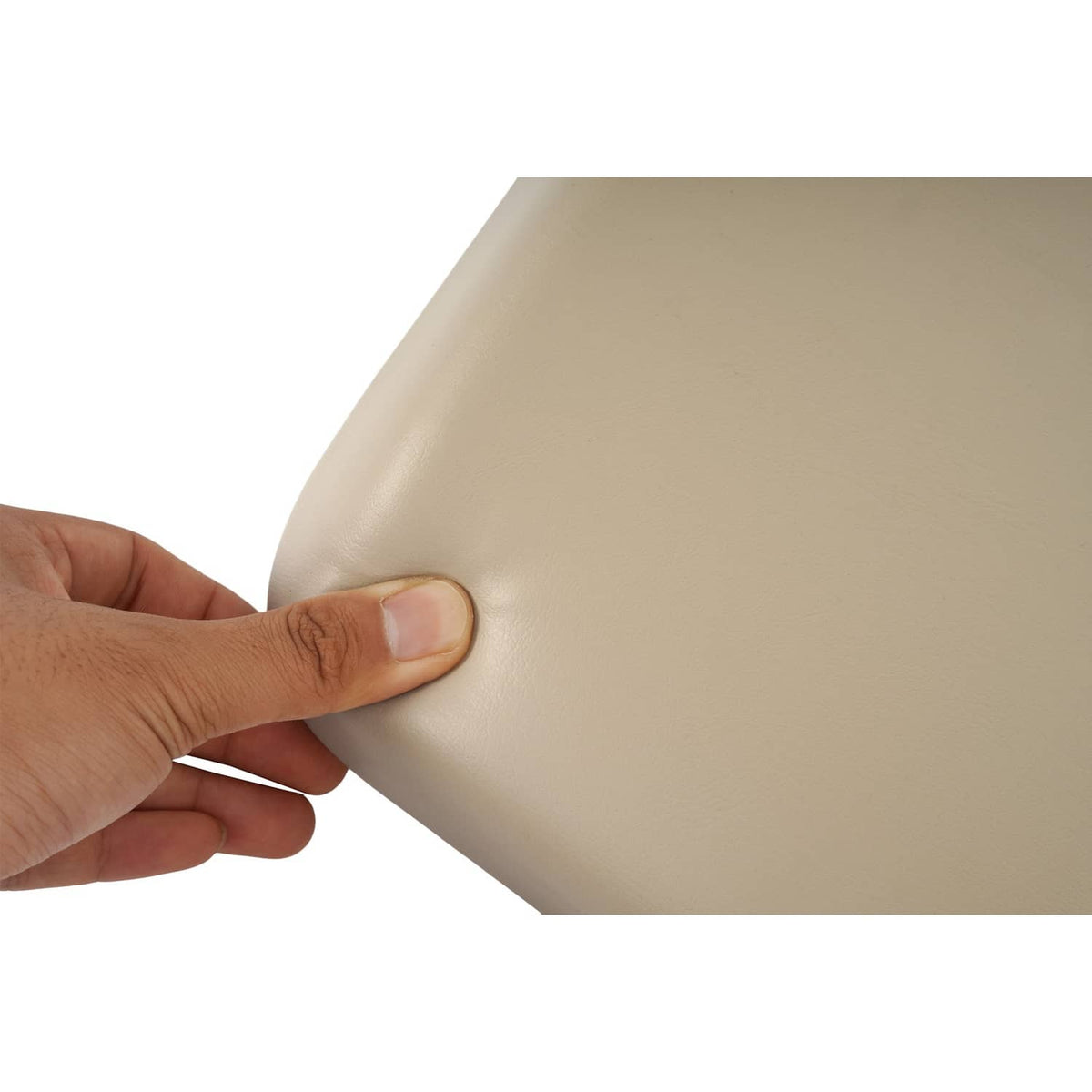 Tan cushion cover with smooth finish, pressed by a hand