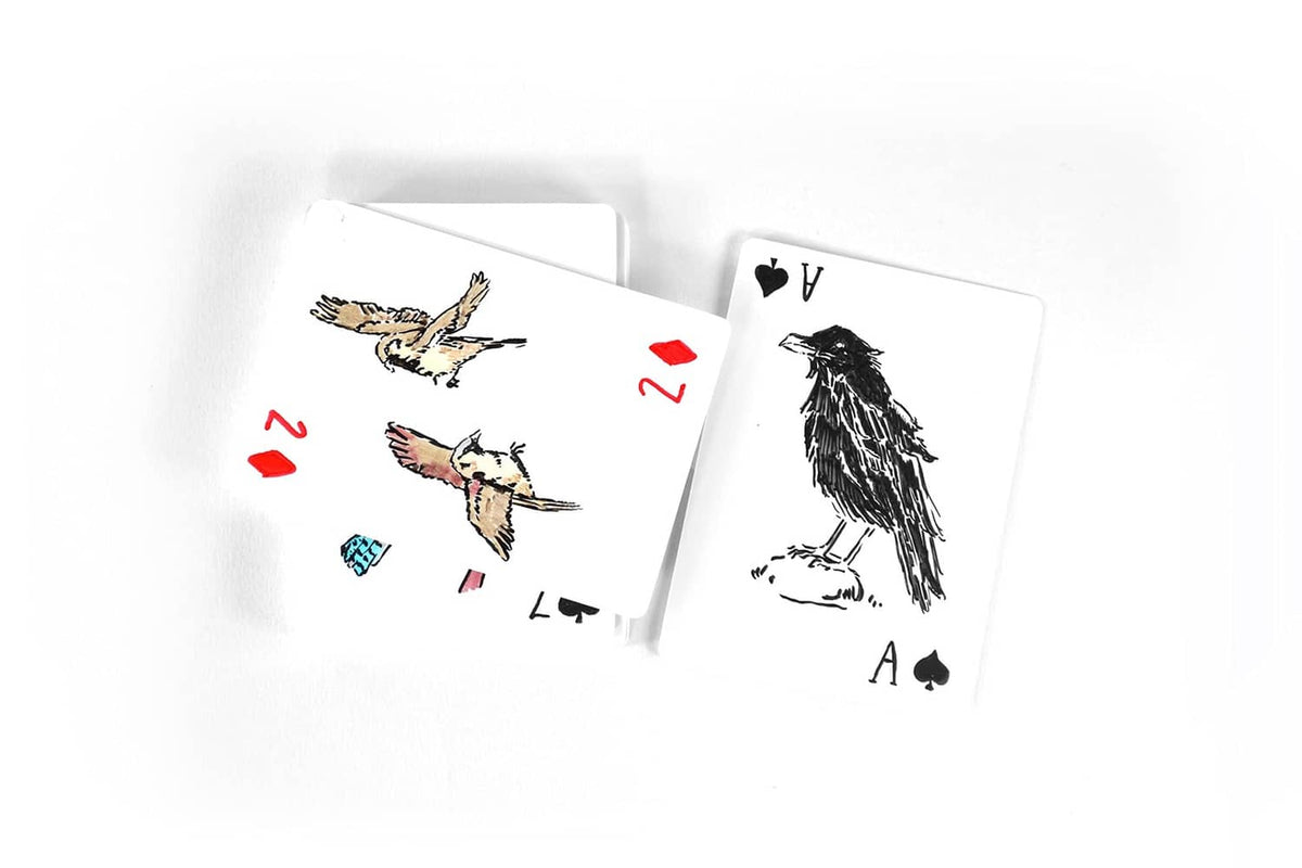Two playing cards with animal illustrations and red suit symbols, slightly fanned