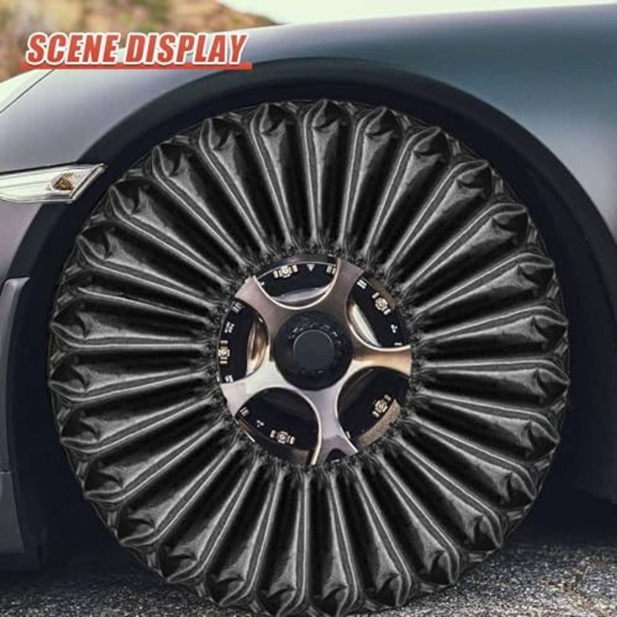 Close-up of black tire wheel cover with gathered texture over a rim