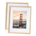 Pair of natural wood 16x20 picture frames with white mat and clear front