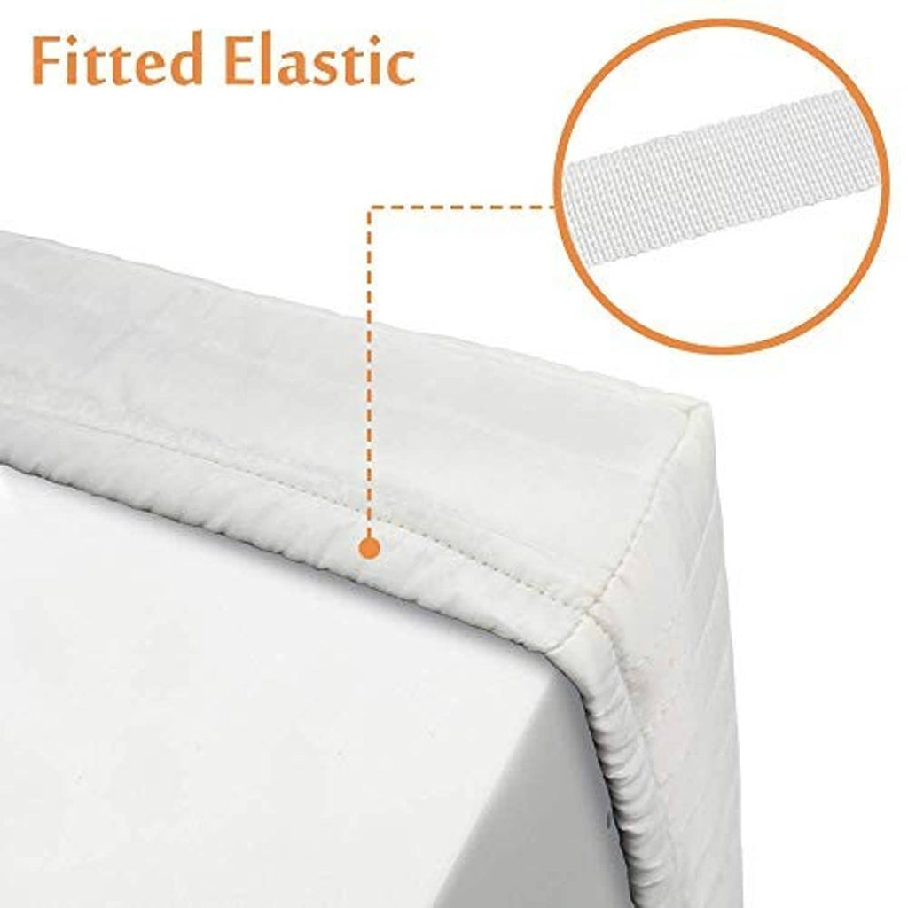Cream AC cover seam with fitted elastic band detail on quilted padding.