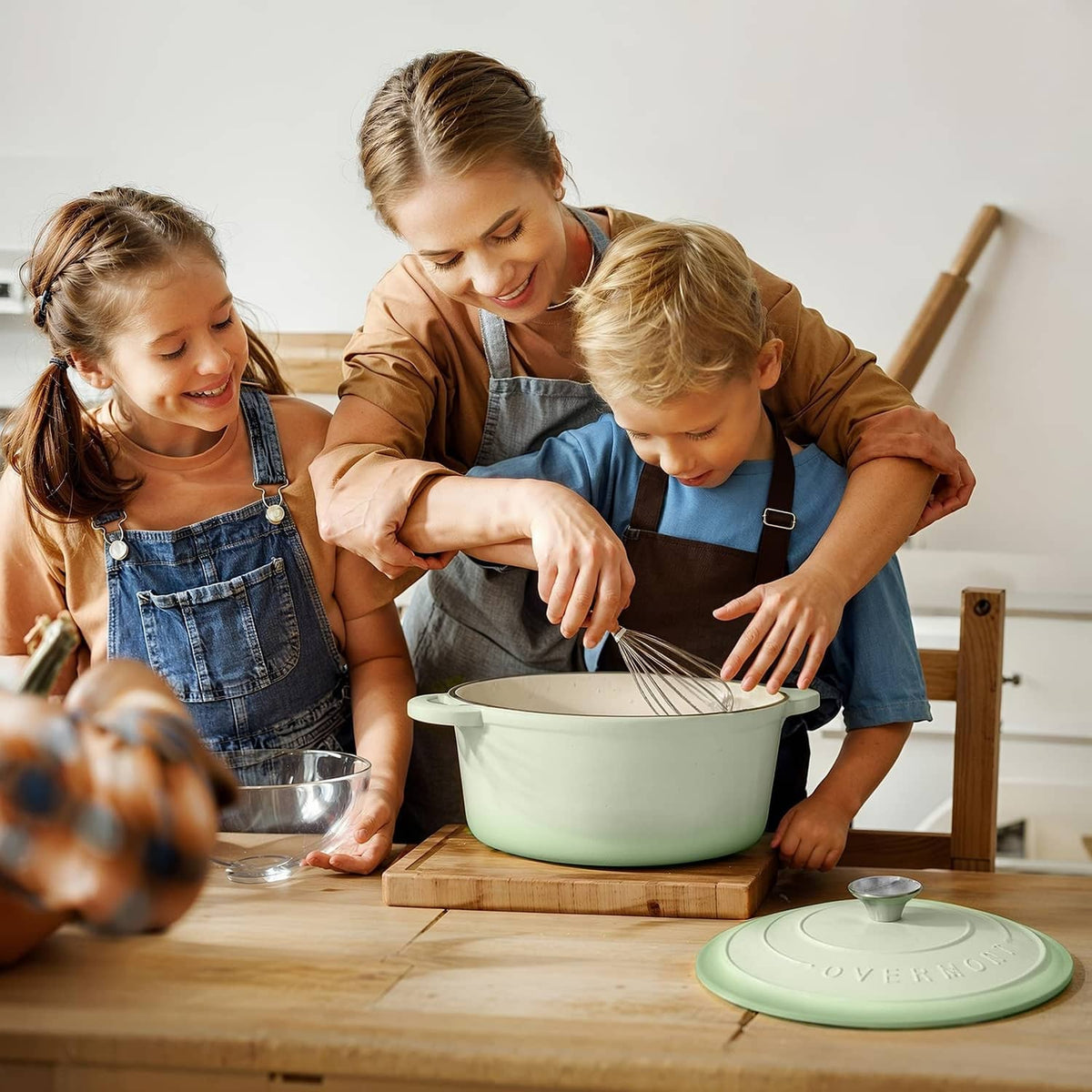 Verdant green enameled Dutch oven on a countertop during meal prep