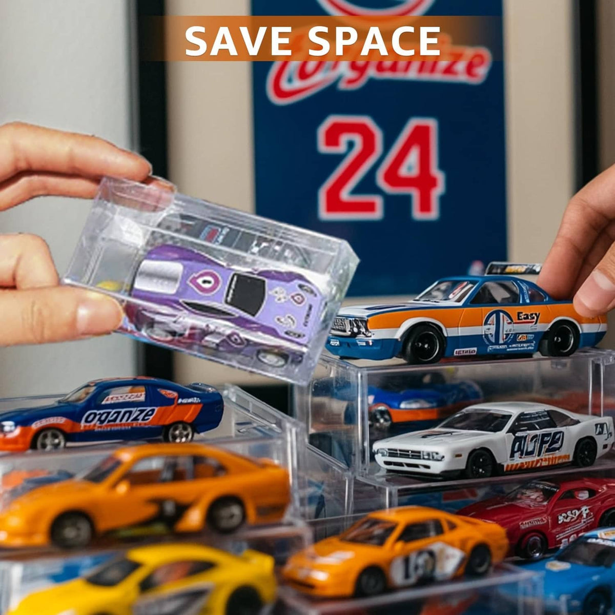 Hands holding clear 1/64 scale model car display case near boxed cars