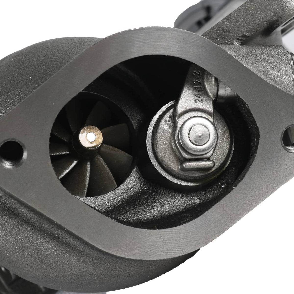 Close-up of black compressor wheel housing with steel center bearing.