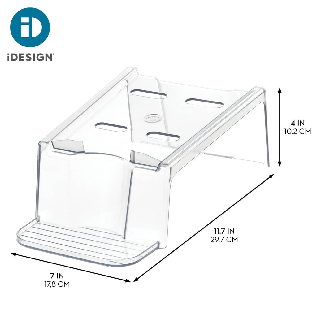 Clear plastic laundry detergent holder with open compartments and base rack for bottles.
