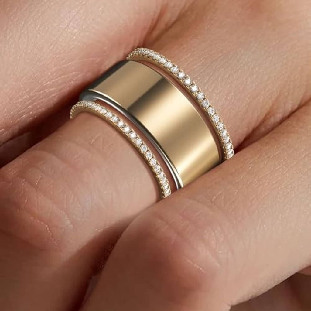 Gold stackable ring bands with pavé edges on a finger