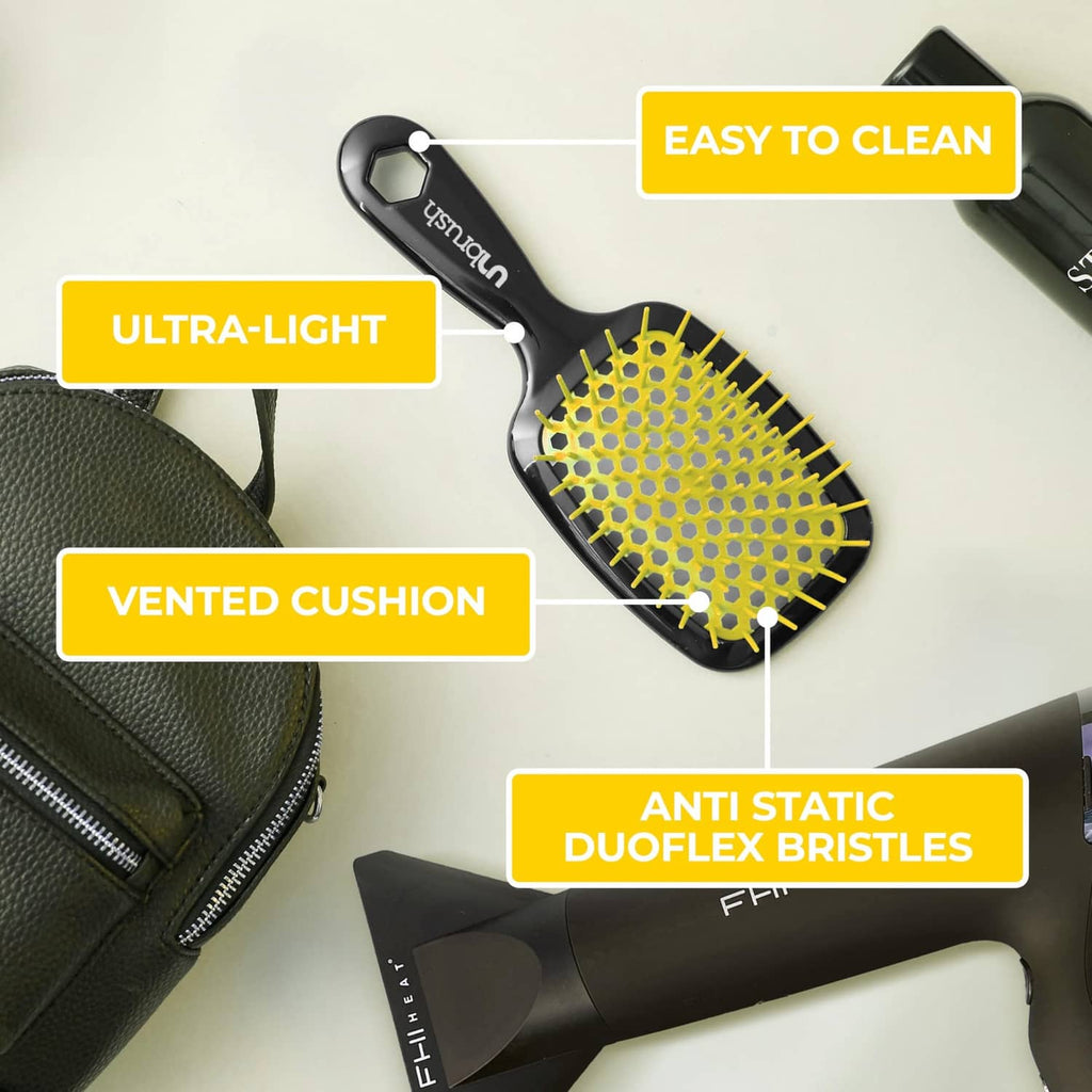Sunburst wet and dry detangling brush with yellow bristles and black vented handle