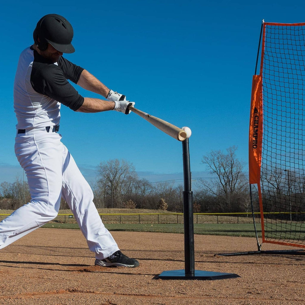Baseball batting practice with black adjustable tee and bat at the field