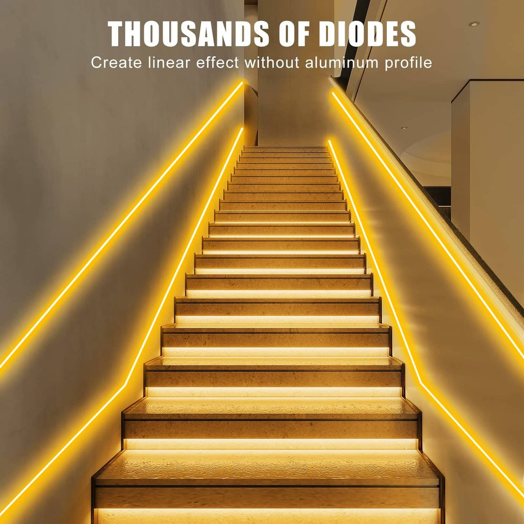 Warm yellow LED strip lights outlining an indoor staircase steps and side edges