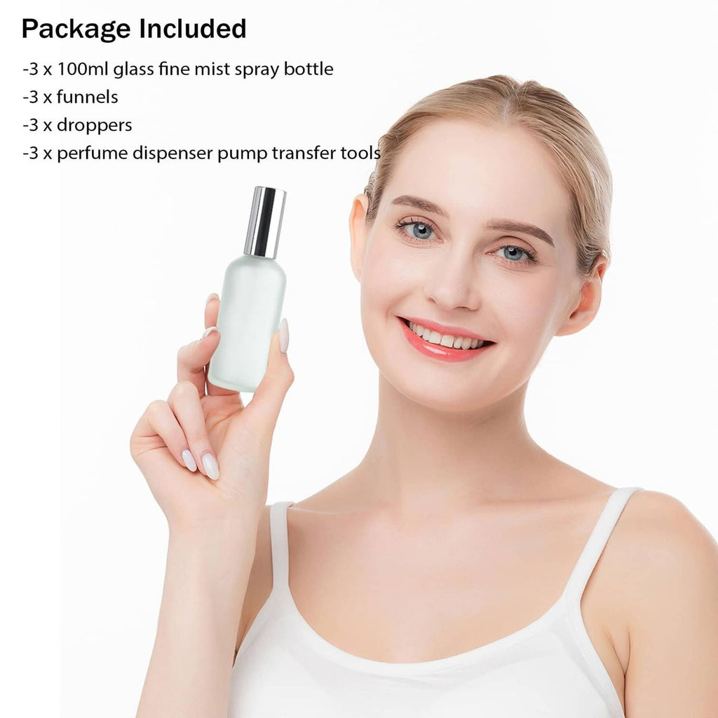 Refillable glass perfume atomizer bottle with chrome cap, shown being held