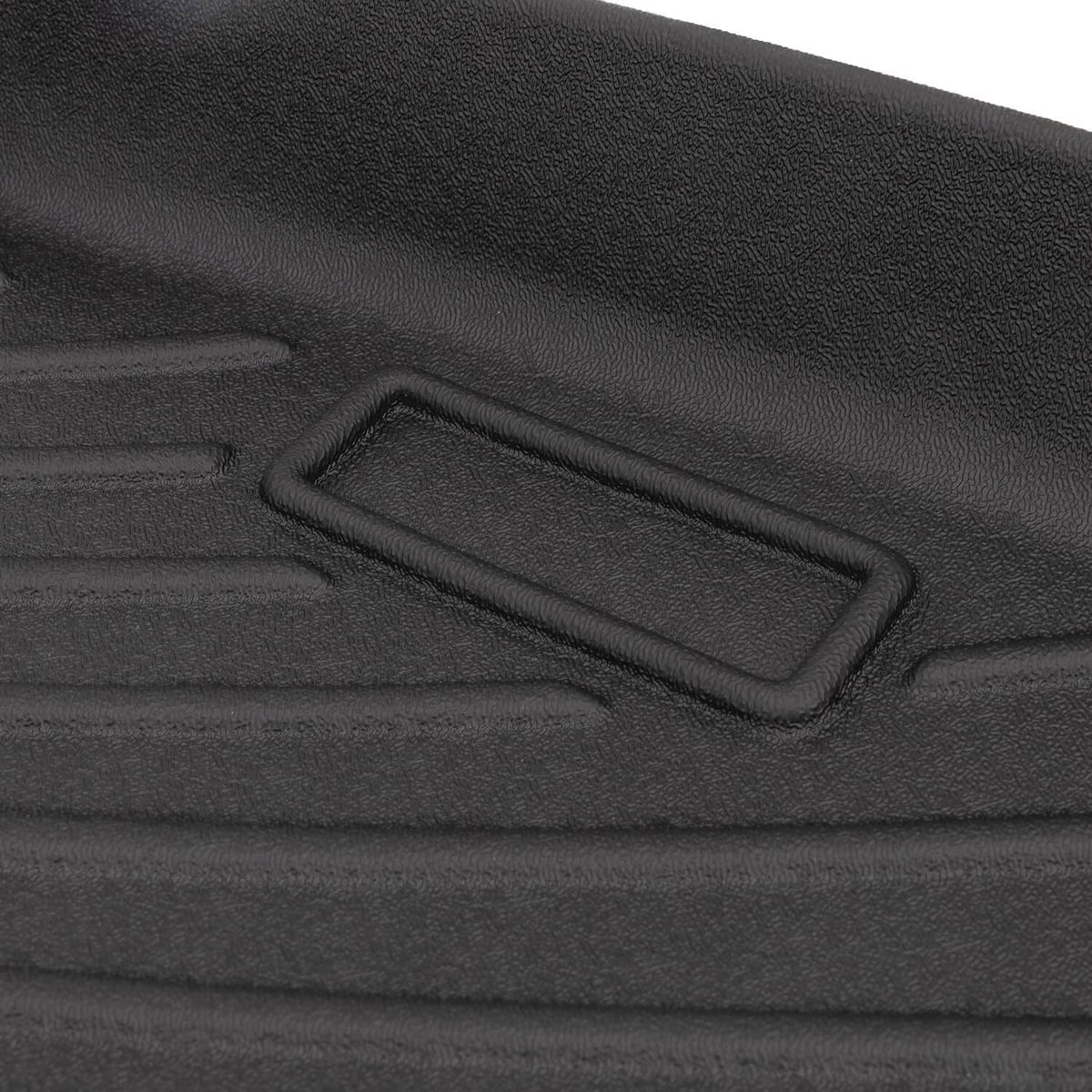 Black cargo liner edge detail with molded trim and rectangular anchor slot