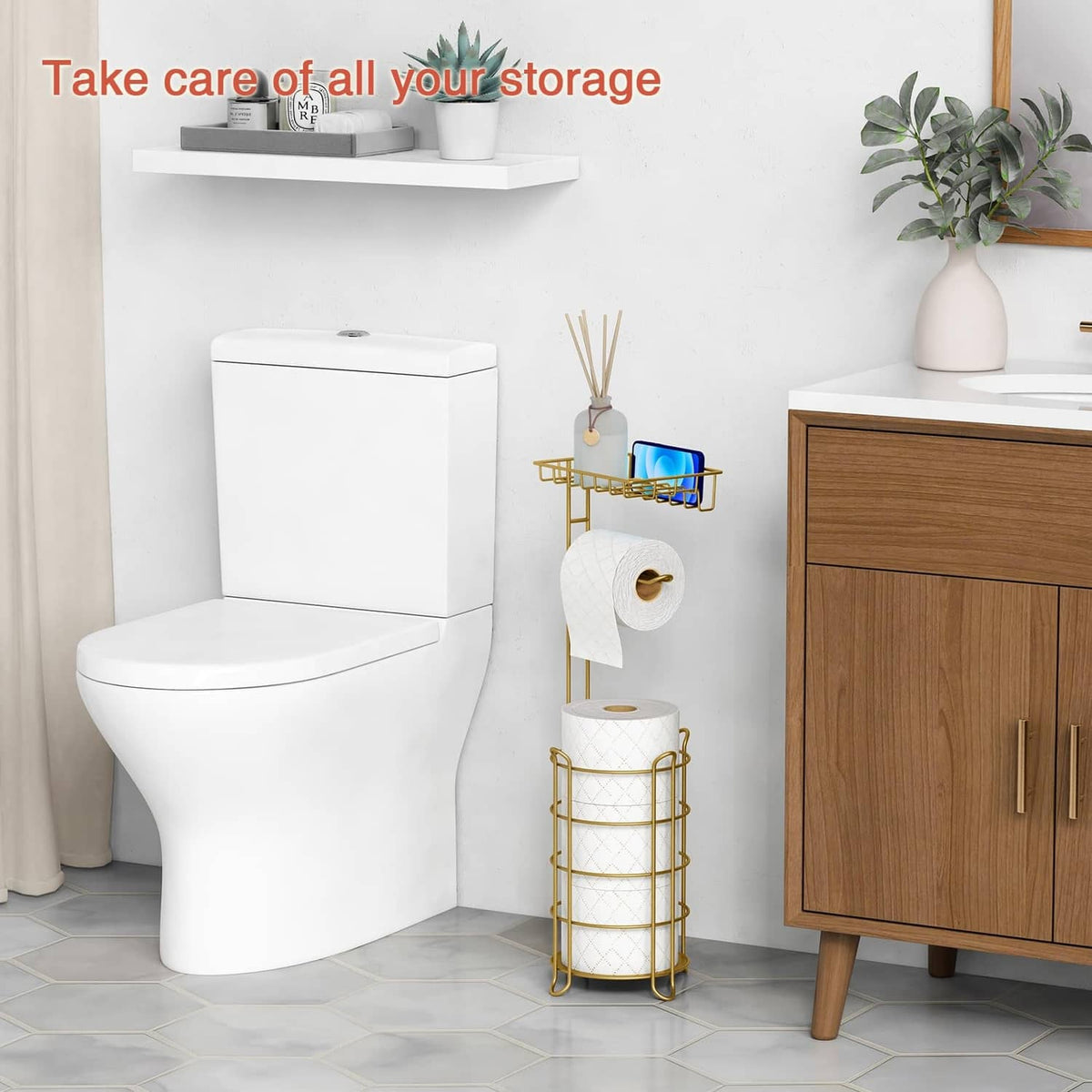 Gold freestanding toilet paper holder with round roll storage beside toilet
