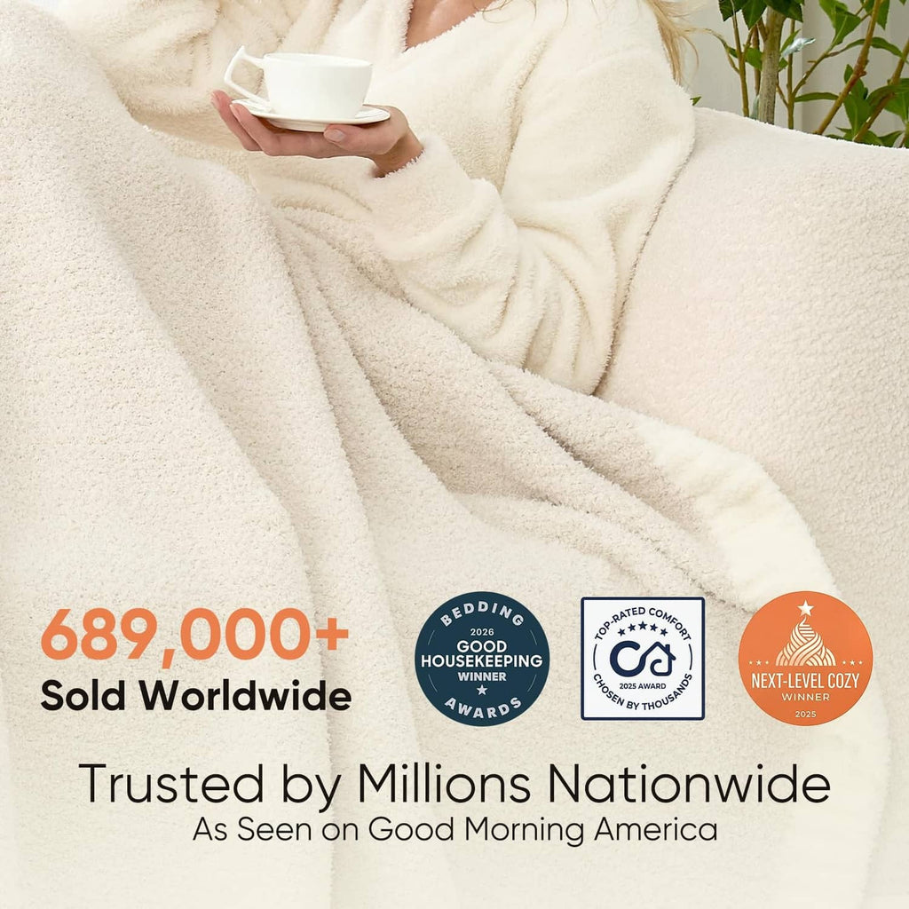 Ivory plush throw blanket with soft folds and thick cuddle-ready texture