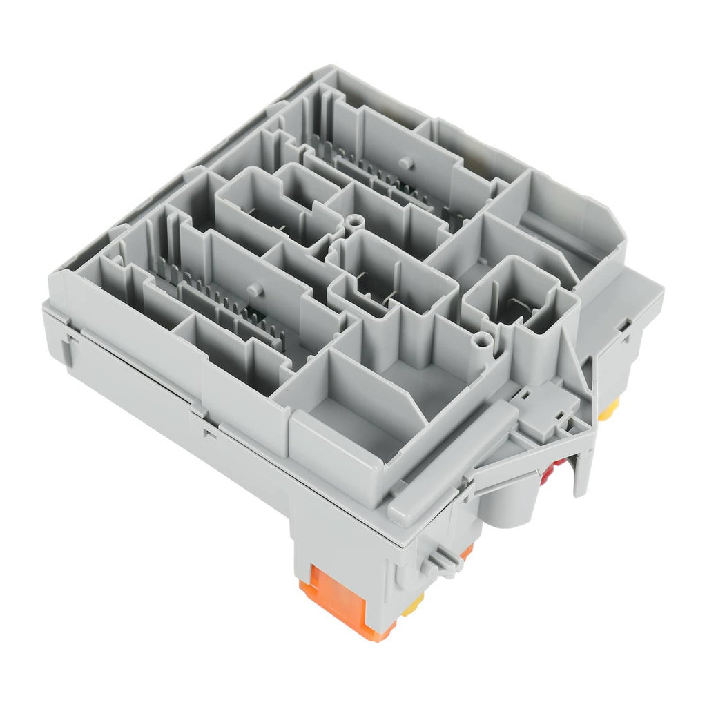 Automotive fuse box base with empty gray fuse slots and molded inner compartments.