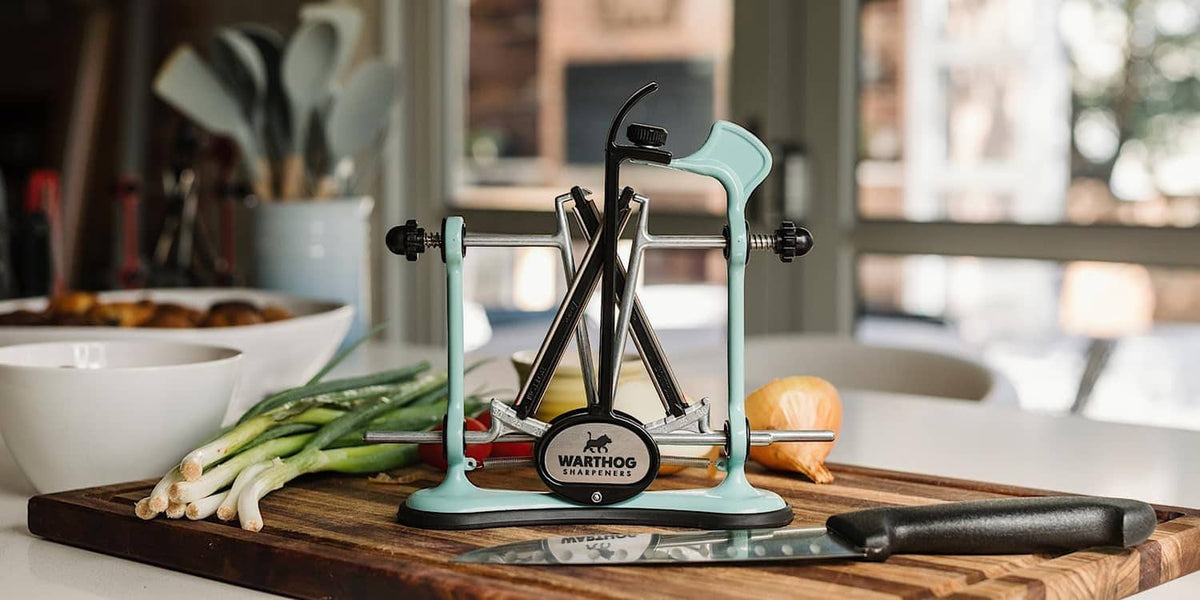V-shaped knife sharpener with diamond rods and blue stand for countertop use
