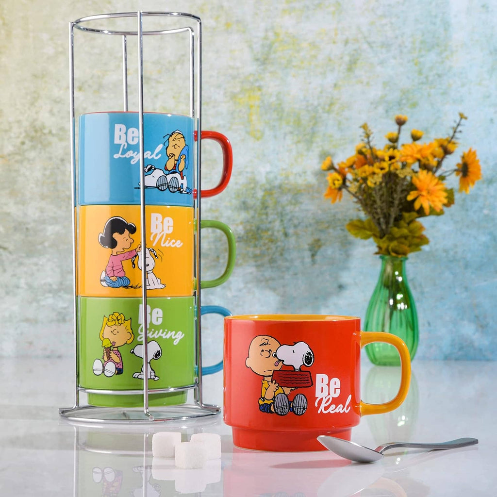 Stacked Snoopy stoneware mugs in metal rack with orange and red mugs shown.