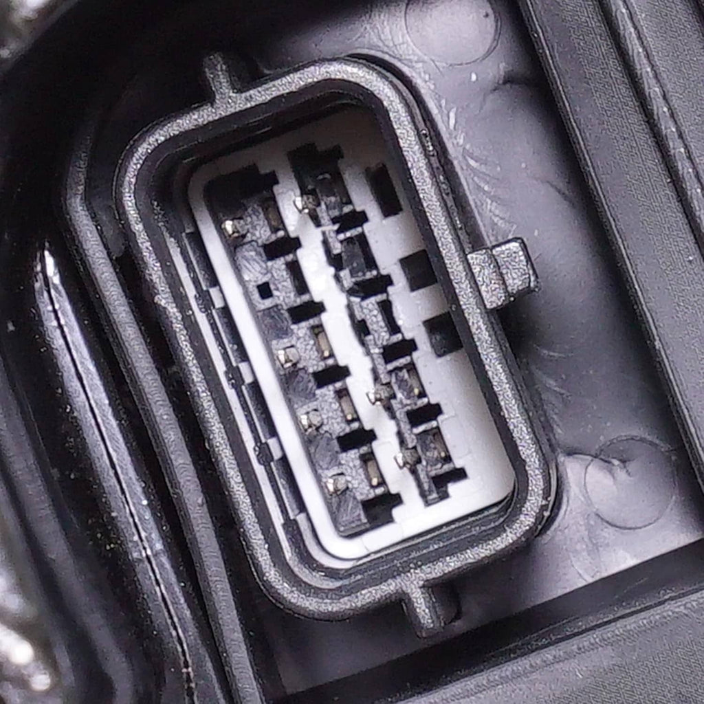 Close-up of rear mirror electrical connector inside sealed plastic housing