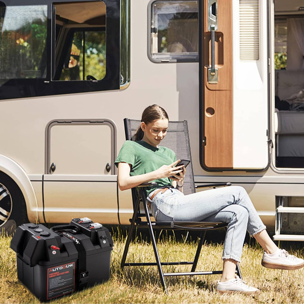 Portable 12V battery power box outdoors connected to a camper van power setup