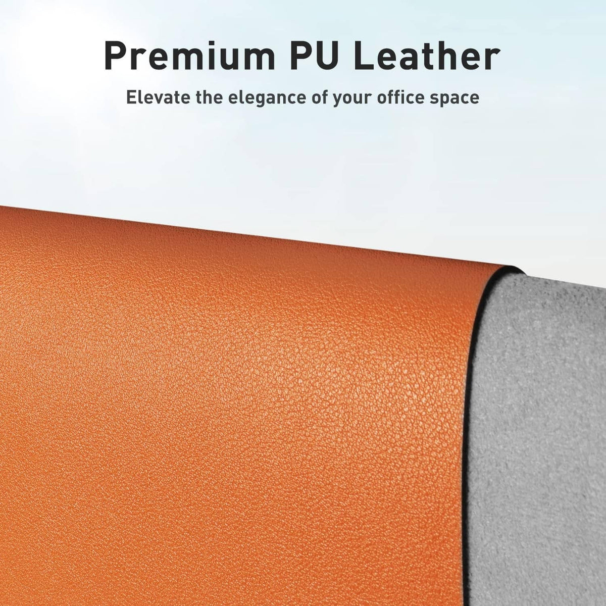 Orange PU leather desk pad with textured surface and gray underside edge