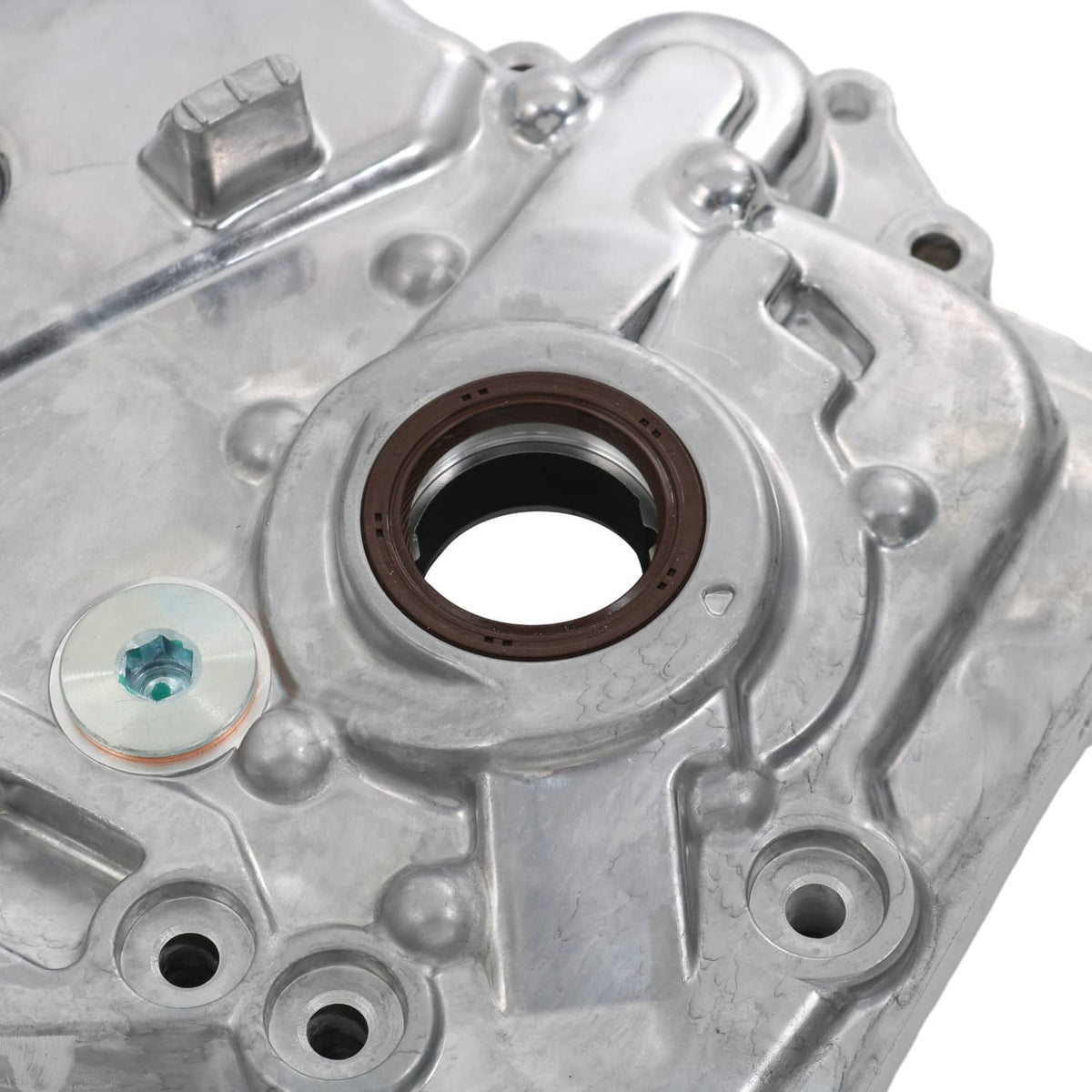 Timing cover oil pump housing close-up with brown seal ring and mounting screw holes