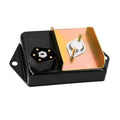 Black ignition control module with copper-toned cover and two stud terminals